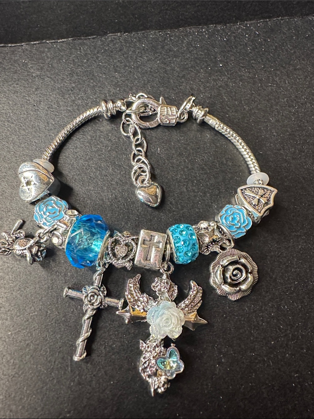 Silver Tone Blue Charm Bracelet with Cross & Floral Charms